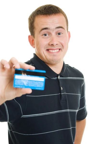 Man met een debit-card op een witte achtergrond. Stockfoto