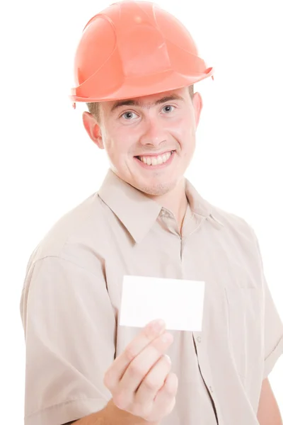 Empresario en casco con tarjeta de visita en la mano . — Foto de Stock