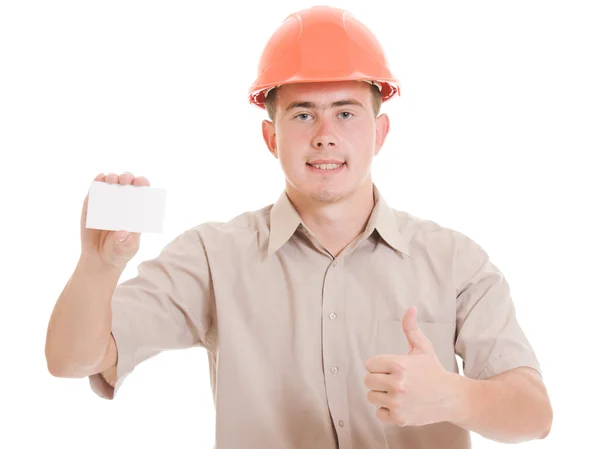 Бизнесмен в шлеме с визитной карточкой в руке . — стоковое фото