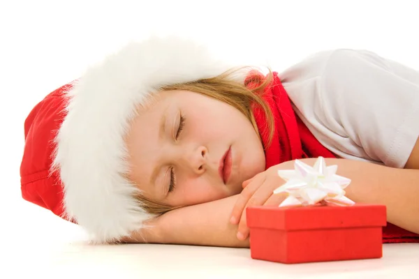 Christmas child is sleeping on the floor. — Stock Photo, Image