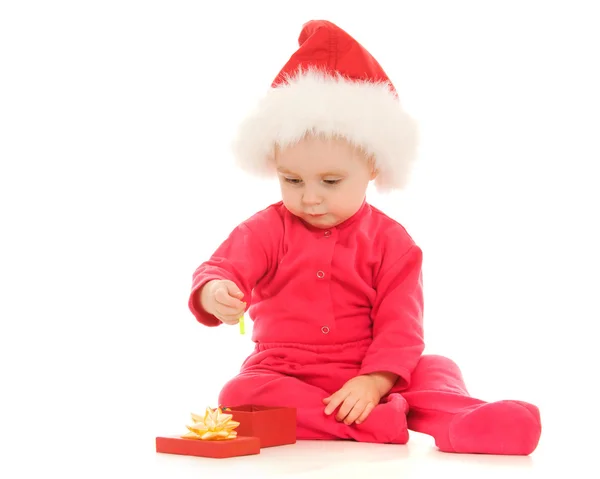Happy Christmas baby with a present in a box on a white background. — Stock Photo, Image