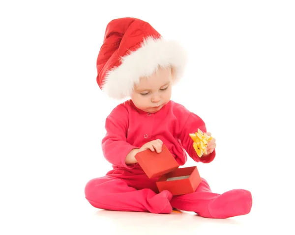 Happy Christmas baby with a present in a box on a white background. — Stock Photo, Image