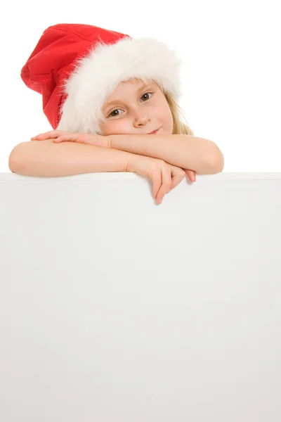 Gelukkig Kerstmis kind met de Raad van bestuur op een witte achtergrond. — Stockfoto