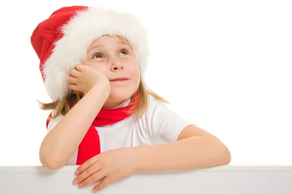 Ευτυχισμένο παιδί Χριστούγεννα με το Διοικητικό Συμβούλιο, κοιτώντας ψηλά σε λευκό φόντο. — Φωτογραφία Αρχείου