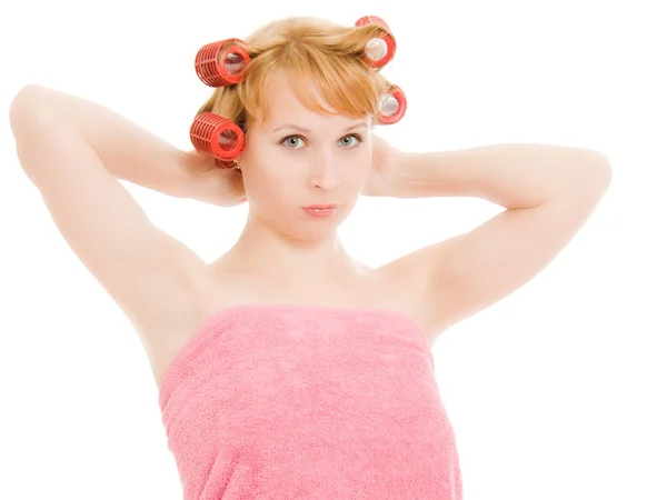 Woman in curlers on a white background. — Stock Photo, Image