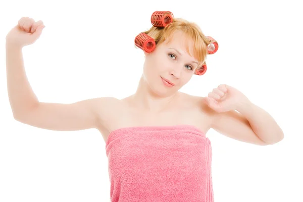 Woman in curlers stretched on a white background. — Stock Photo, Image