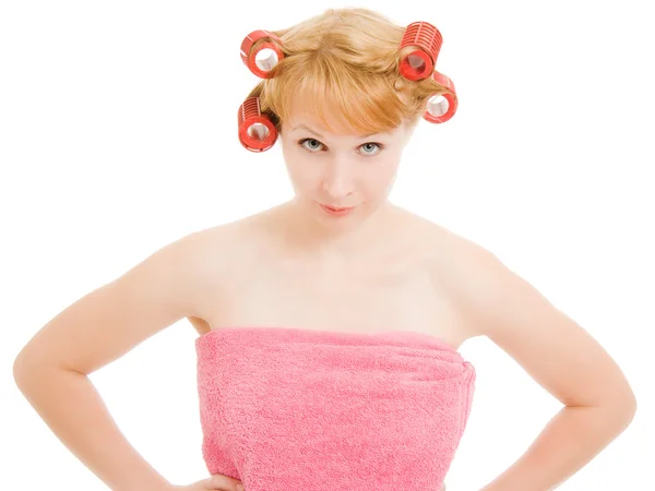 The strict woman in curlers on a white background. — Stock Photo, Image