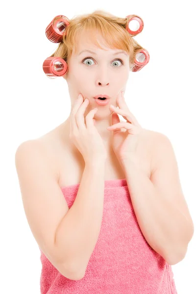 Woman in curlers moans on a white background. — Stock Photo, Image