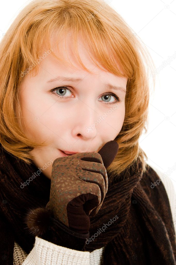 A woman coughs on a white background.