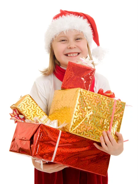 Beyaz bir arka plan kutuları hediyelerle mutlu bir Noel çocuk. — Stok fotoğraf