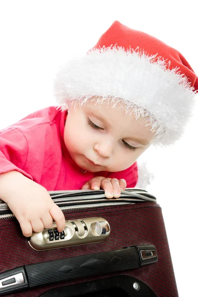 Bebé de Navidad en la maleta sobre un fondo blanco . — Foto de Stock