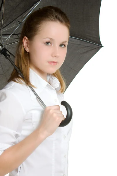 Uma mulher sob um guarda-chuva em um fundo branco . — Fotografia de Stock