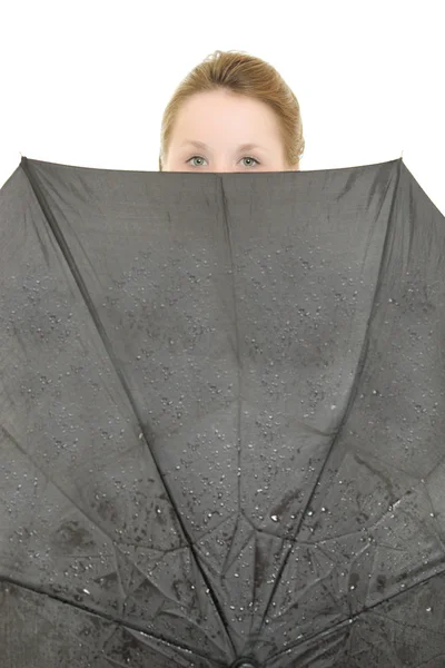 Egy nő, alatt egy esernyő, egy fehér háttér. — Stock Fotó