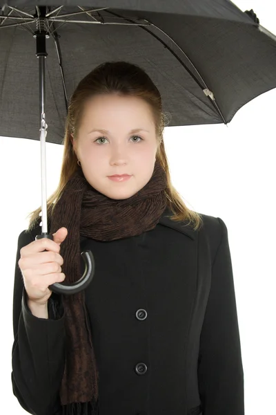 Een vrouw onder een paraplu op een witte achtergrond. — Stockfoto