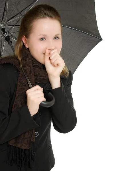 Eine Frau unter einem Regenschirm auf weißem Hintergrund. — Stockfoto