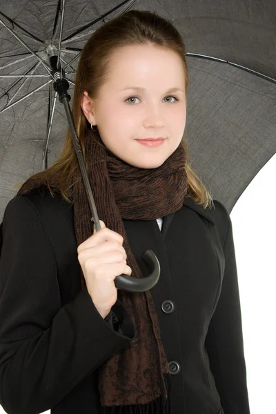 Uma mulher sob um guarda-chuva em um fundo branco . — Fotografia de Stock