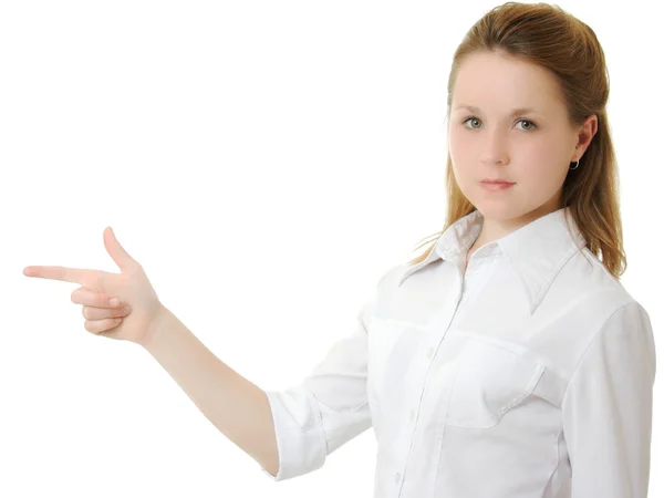 Zakenvrouw wijst een vinger op een witte achtergrond. — Stockfoto