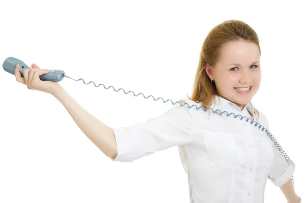 Femme déchire le cordon du téléphone sur un fond blanc . — Photo