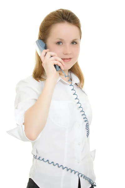 Femme avec fil de téléphone enroulé sur un fond blanc . — Photo