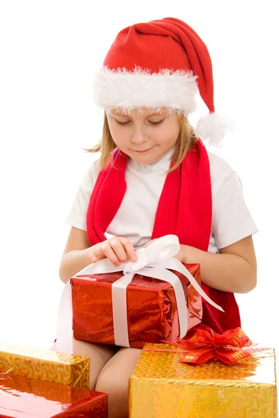 Happy Christmas child with gifts in the boxes on a white background. Stock Picture