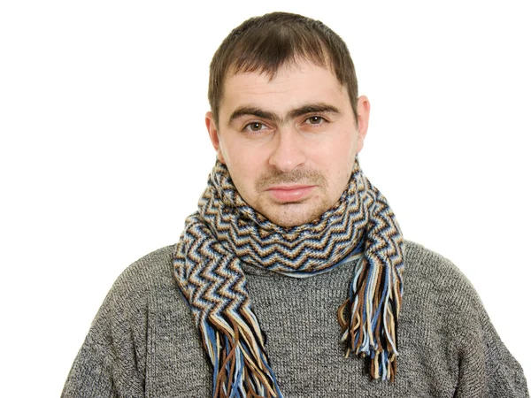 Zieke man dragen een sjaal op een witte achtergrond. — Stockfoto