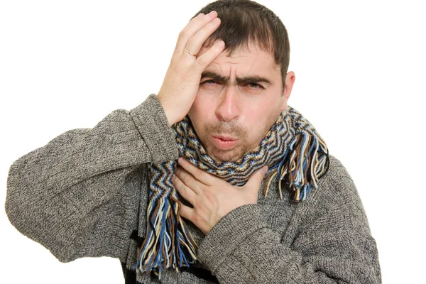 Uomo malato indossa una sciarpa su uno sfondo bianco . — Foto Stock