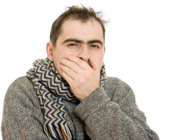 Hombre enfermo con una bufanda sobre un fondo blanco . — Foto de Stock