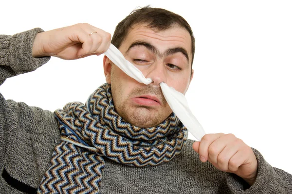 En patient man med en rinnande näsa. — Stockfoto
