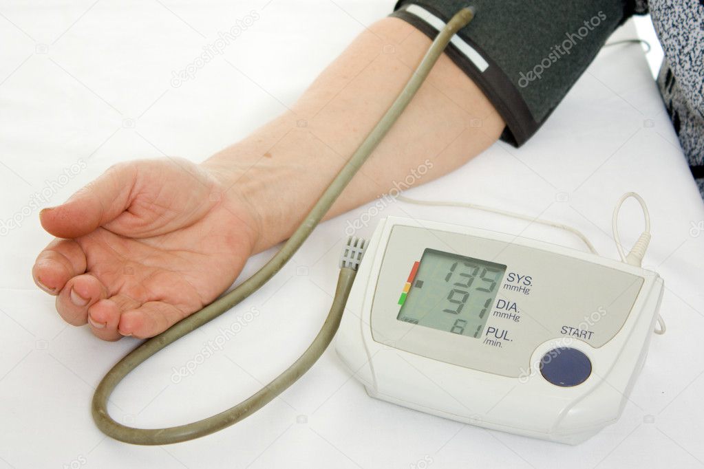 Hand an elderly woman with a sphygmomanometer on a white background.