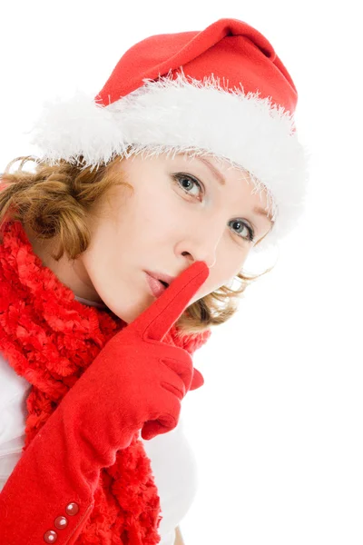 Happy Christmas woman points to the silence on white background. — Stock Photo, Image