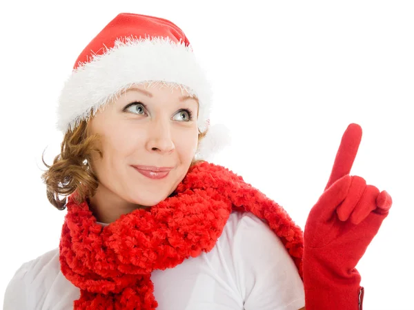 Feliz Navidad mujer señala un dedo hacia arriba sobre un fondo blanco . —  Fotos de Stock