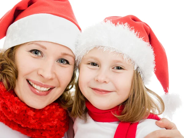 Feliz Navidad madre e hija sobre un fondo blanco . Fotos de stock libres de derechos