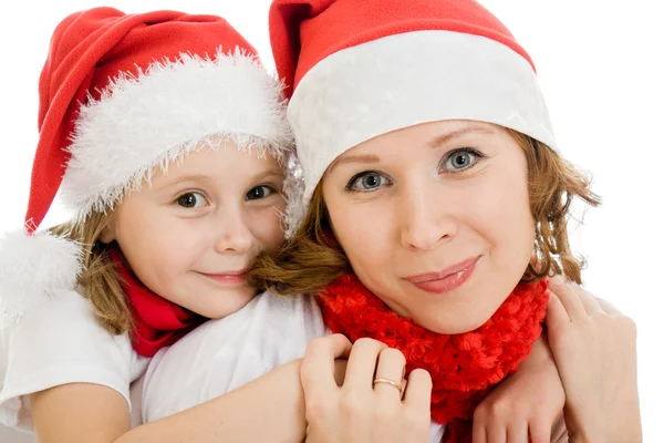С Рождеством мать и дочь на белом фоне . Стоковое Изображение