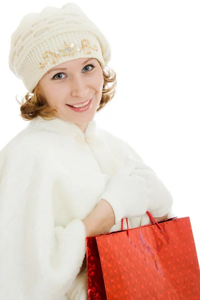 Žena s vánoční dárky na bílém pozadí. — Stock fotografie