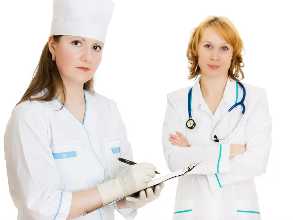 Δύο γυναίκες γιατροί σε λευκό φόντο. — Φωτογραφία Αρχείου