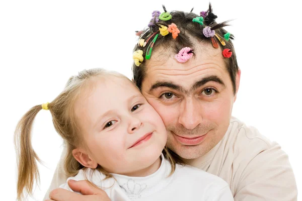 Der Vater umarmt seine Tochter auf weißem Hintergrund. — Stockfoto
