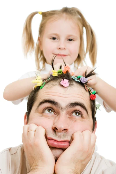 Daughter of braids cornrows his father on a white background. — Stock Photo, Image