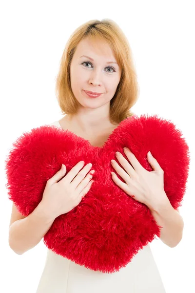 A woman holds a heart in his hands on a white background. — Stock Photo, Image