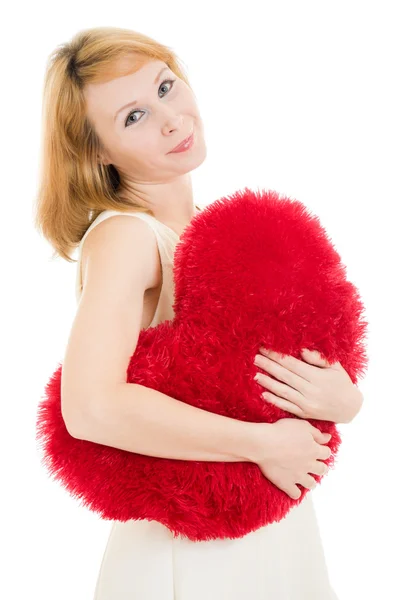 stock image A woman holds a heart in his hands on a white background.