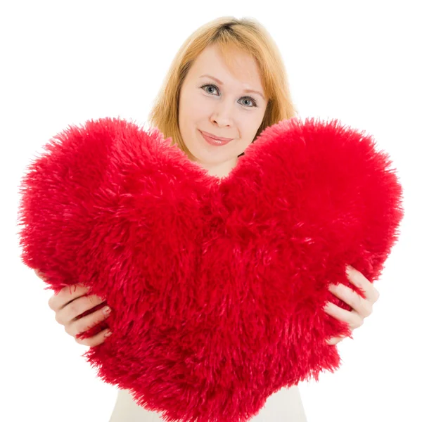 A woman holds a heart in his hands on a white background. — Stock Photo, Image