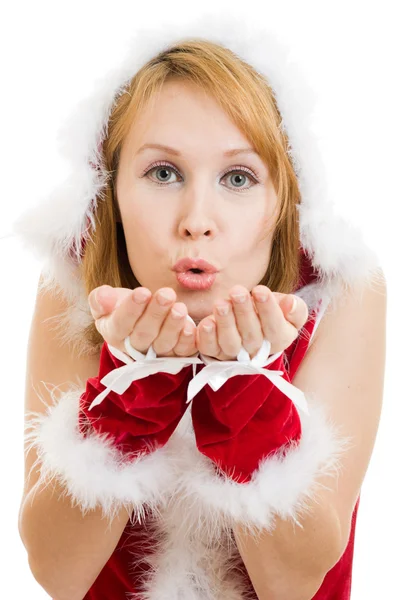 吹上他的手在白色背景上的快乐圣诞女人. — 图库照片