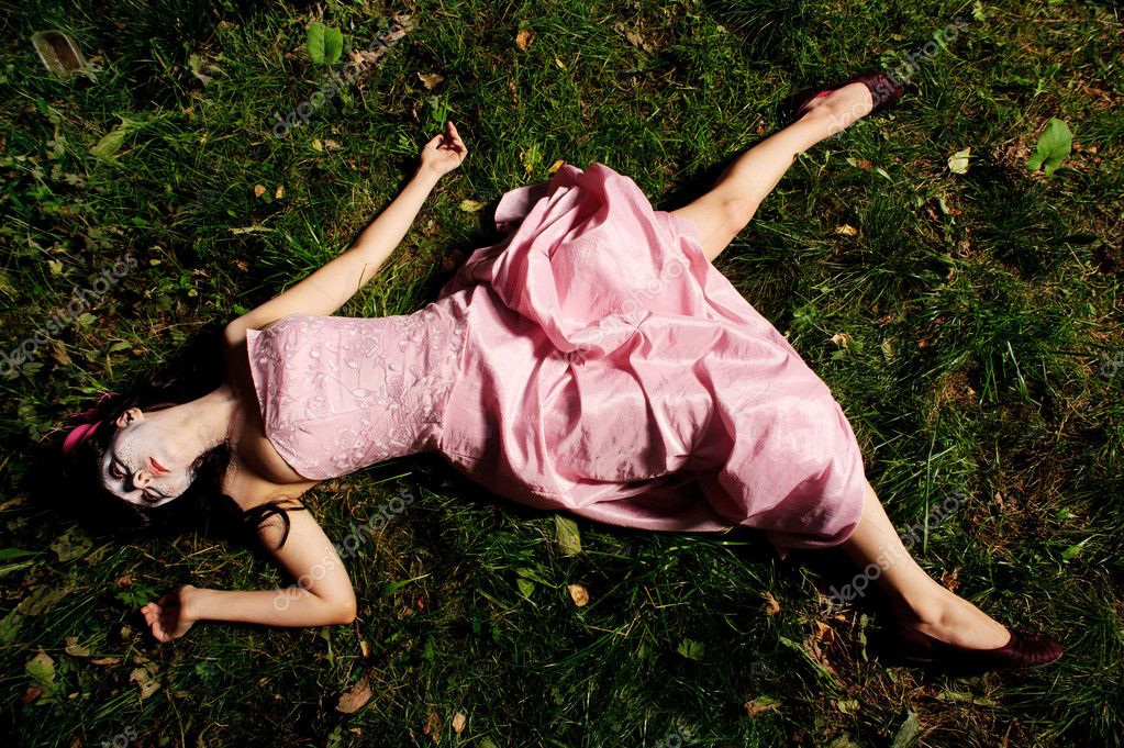 Girl lie on the grass like a corpse — Stock Photo © teamtime #6898721