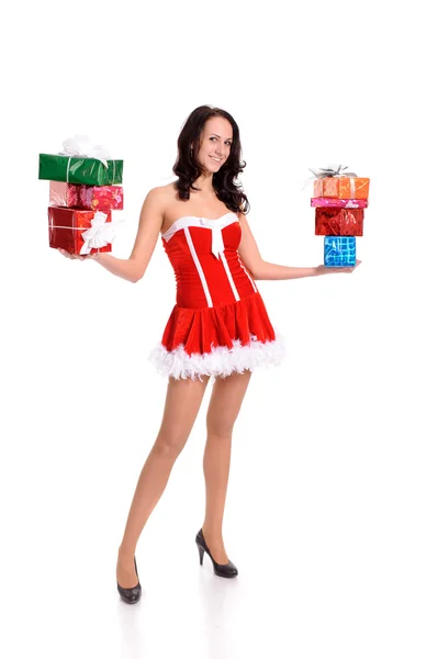 लाल क्रिसमस कपड़े में युवा महिला बहुत सारे वर्तमान बॉक्स के साथ — स्टॉक फ़ोटो, इमेज