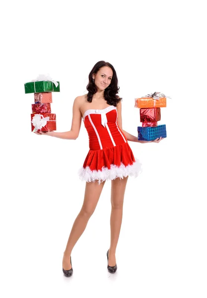 Young woman in red christmas clothing with a lot of present boxe — Stock Photo, Image