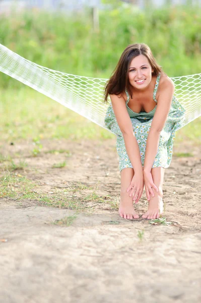 Smiling woman sit on hammock — Stock Photo, Image
