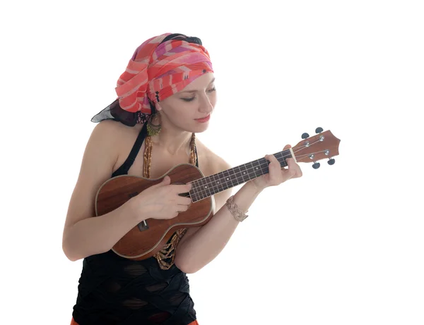 Flickan spelar på ukulele — Stockfoto