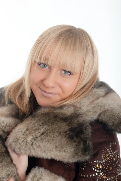 Blonde in a fur coat — Stock Photo, Image