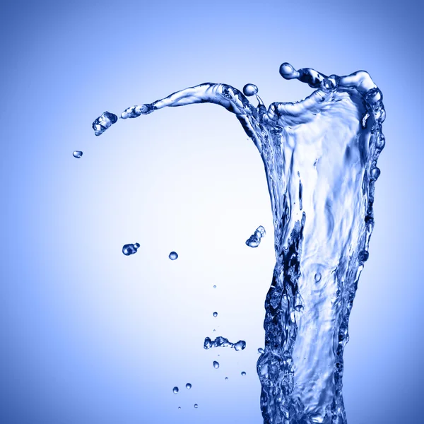 Water spatten op blauwe achtergrond — Stockfoto