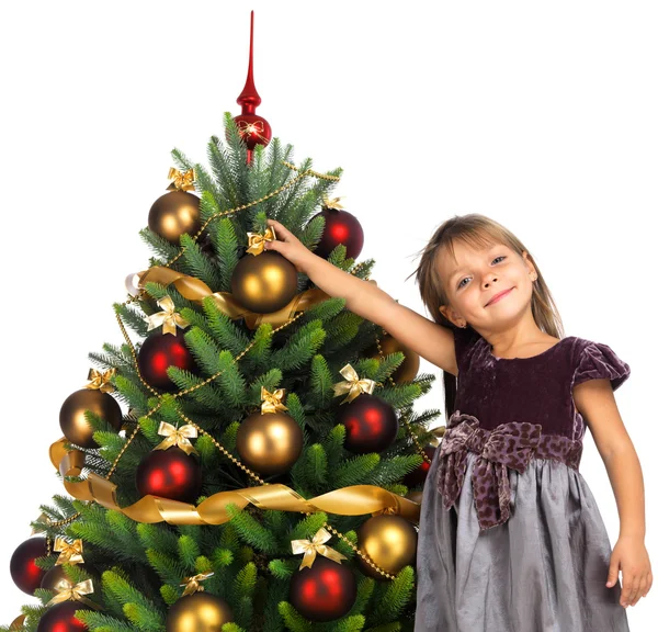 Pretty girl with present near the Christmas tree — Stok fotoğraf