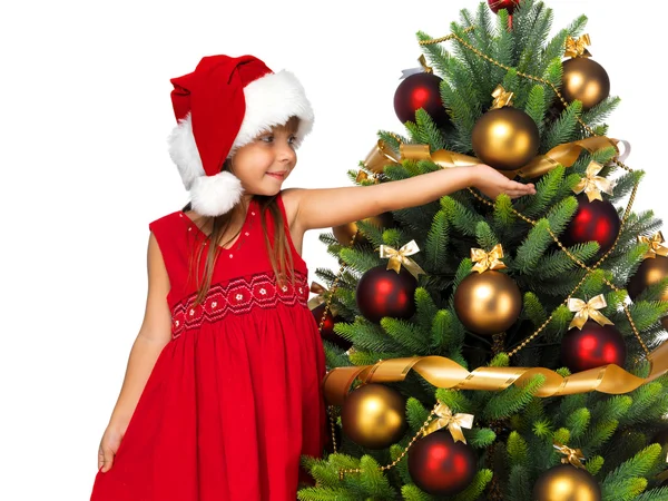Söt flicka med nuvarande nära trädet cristmas — Stockfoto